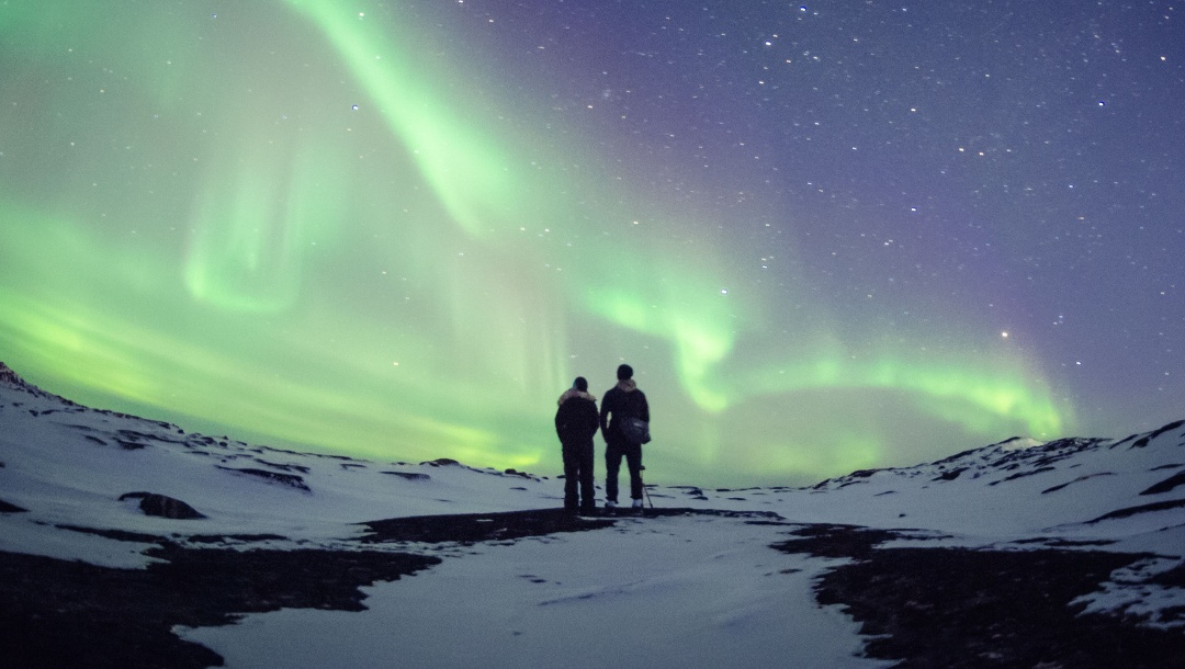 Wandern in Grönland mit Blick aud die Aurora Borealis.